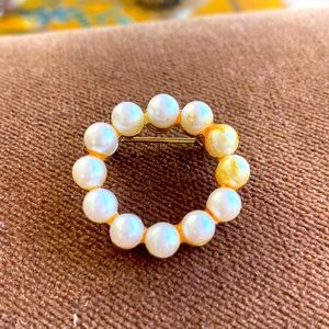 Old patina brass faux Pearl circle pin.